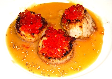 Diver Scallops Topped with Salmon Roe on a Bed of Miso sauce Sprinled with Sesame Seeds