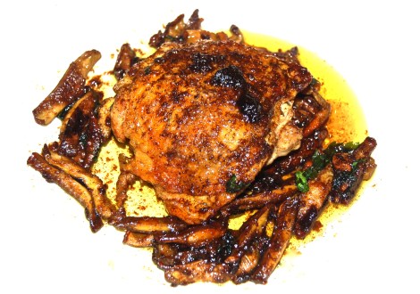 Shiitake Mushrooms Surrond A Curry Butter Chicken Thigh